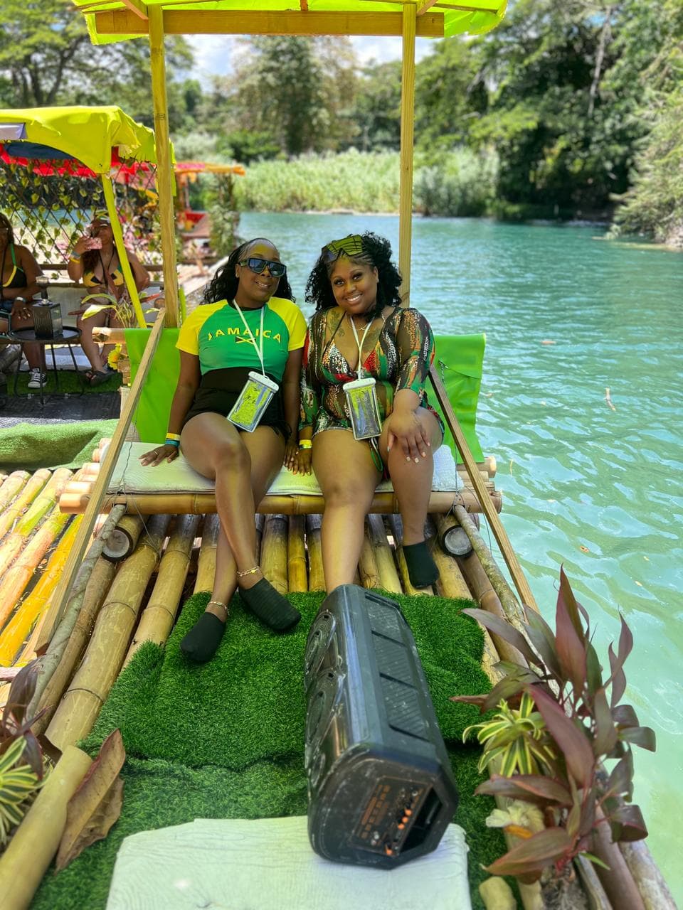 Two guests on a bamboo raft on the White River