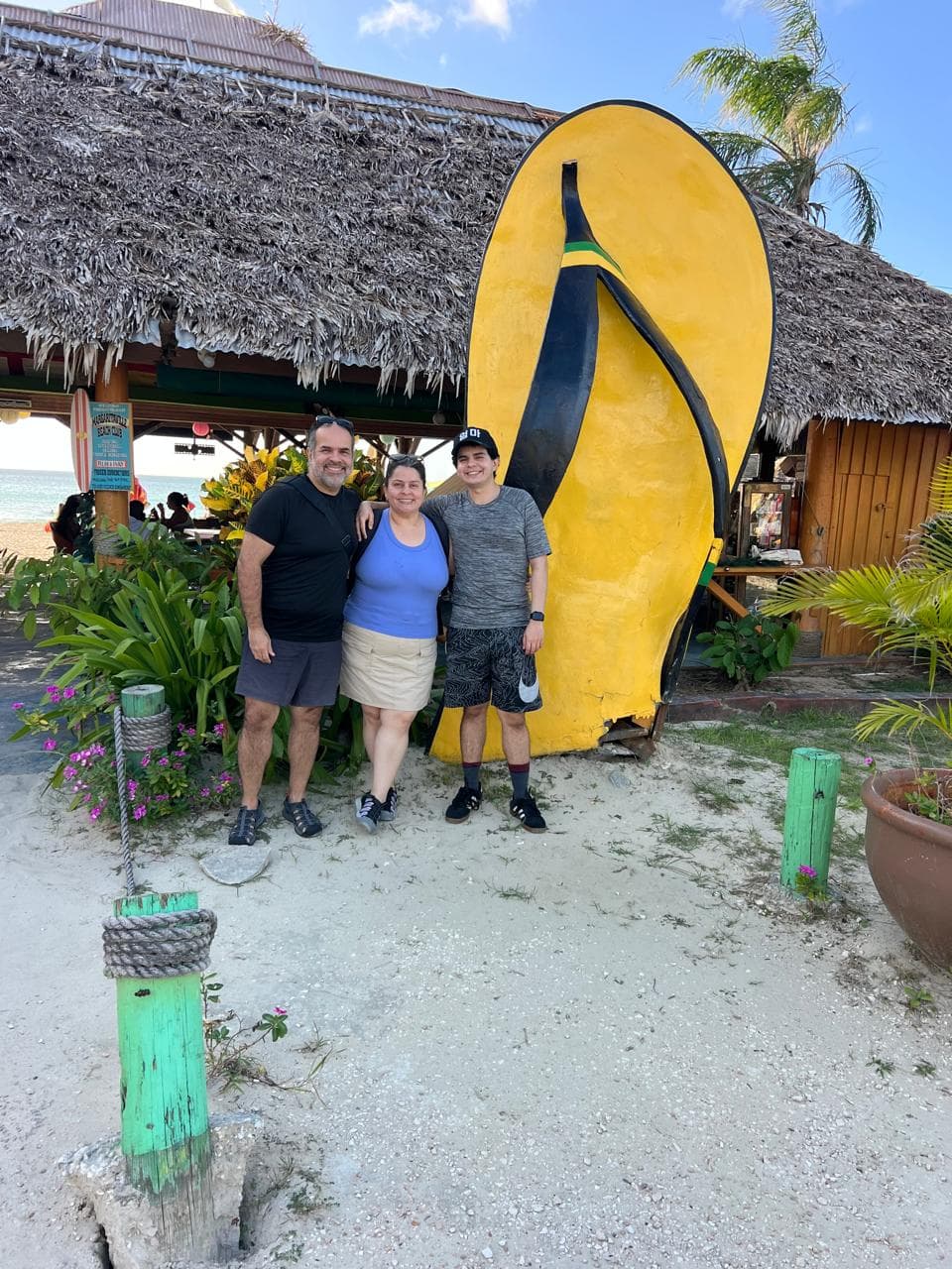 Guests beside the giant flip-flop at Margaritaville on the Hip Strip